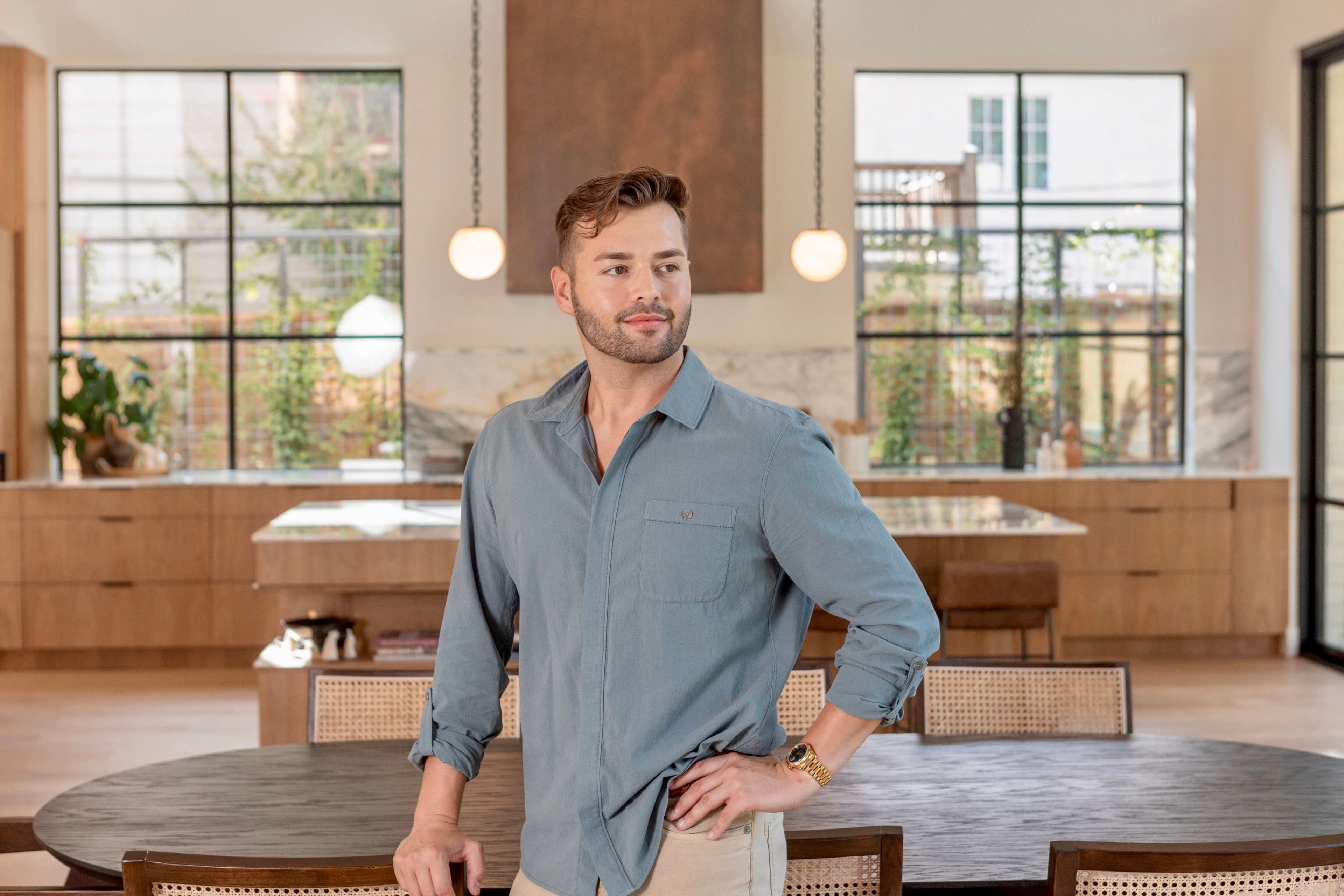 Colton looking off to the side in the kitchen
